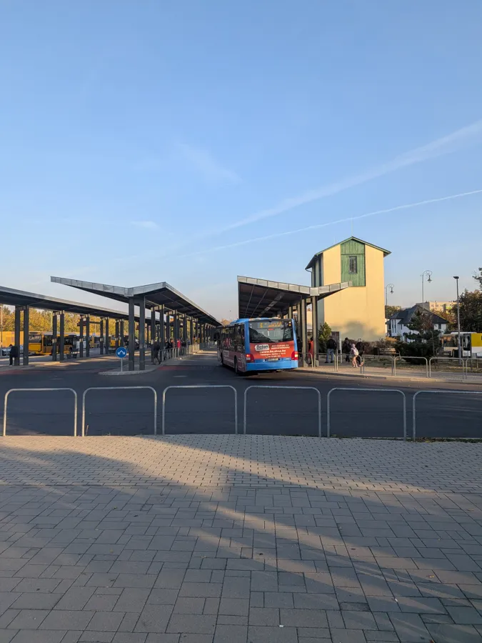 Esztergom bus station with long roofed platforms and a city bus pulling in